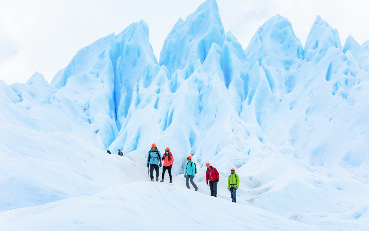 Tourists with guide hiking on Perito Moreno Glacier, Argentina.