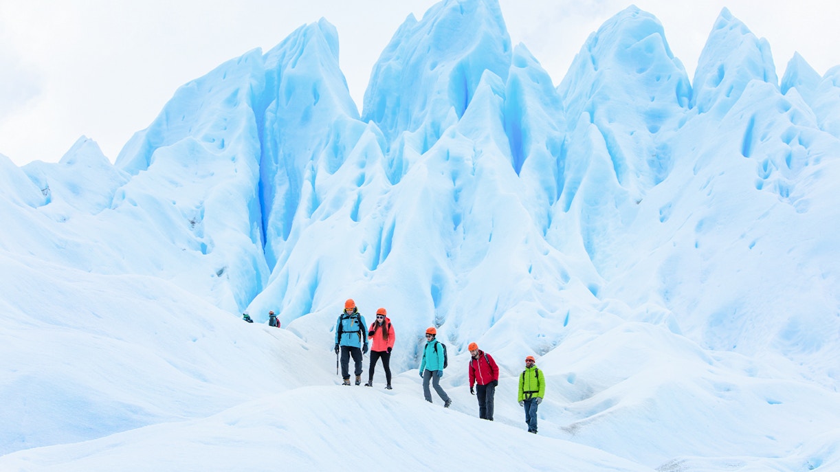 Tourists with guide hiking on Perito Moreno Glacier, Argentina.