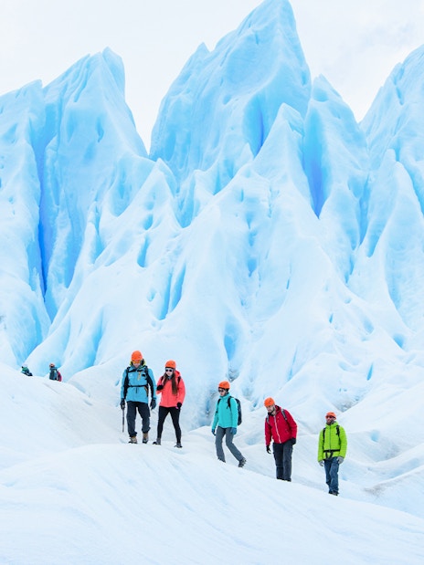 Tourists with guide hiking on Perito Moreno Glacier, Argentina.