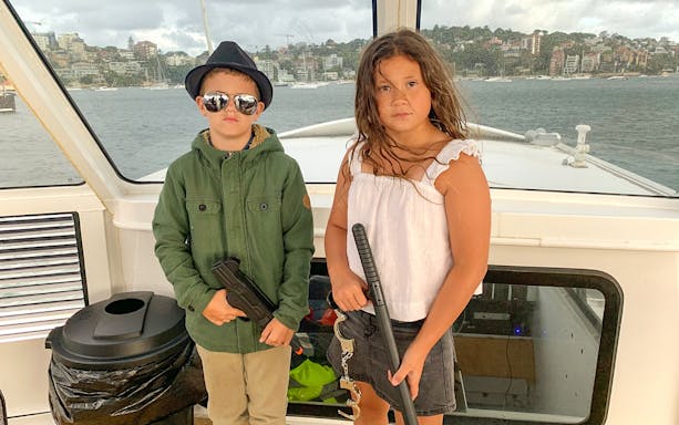 Children dressed as detectives on Sydney Harbour's True Crime Cruise.