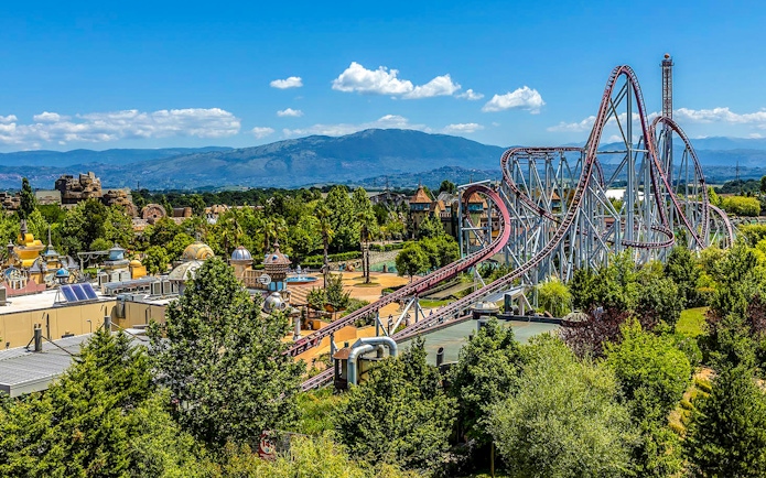 Roller coaster and scenic view at MagicLand Amusement Park.