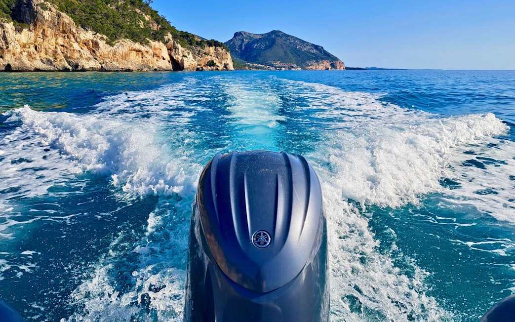 Dinghy cruising in the Gulf of Orosei, view of cliffs and sea from Cala Gonone.