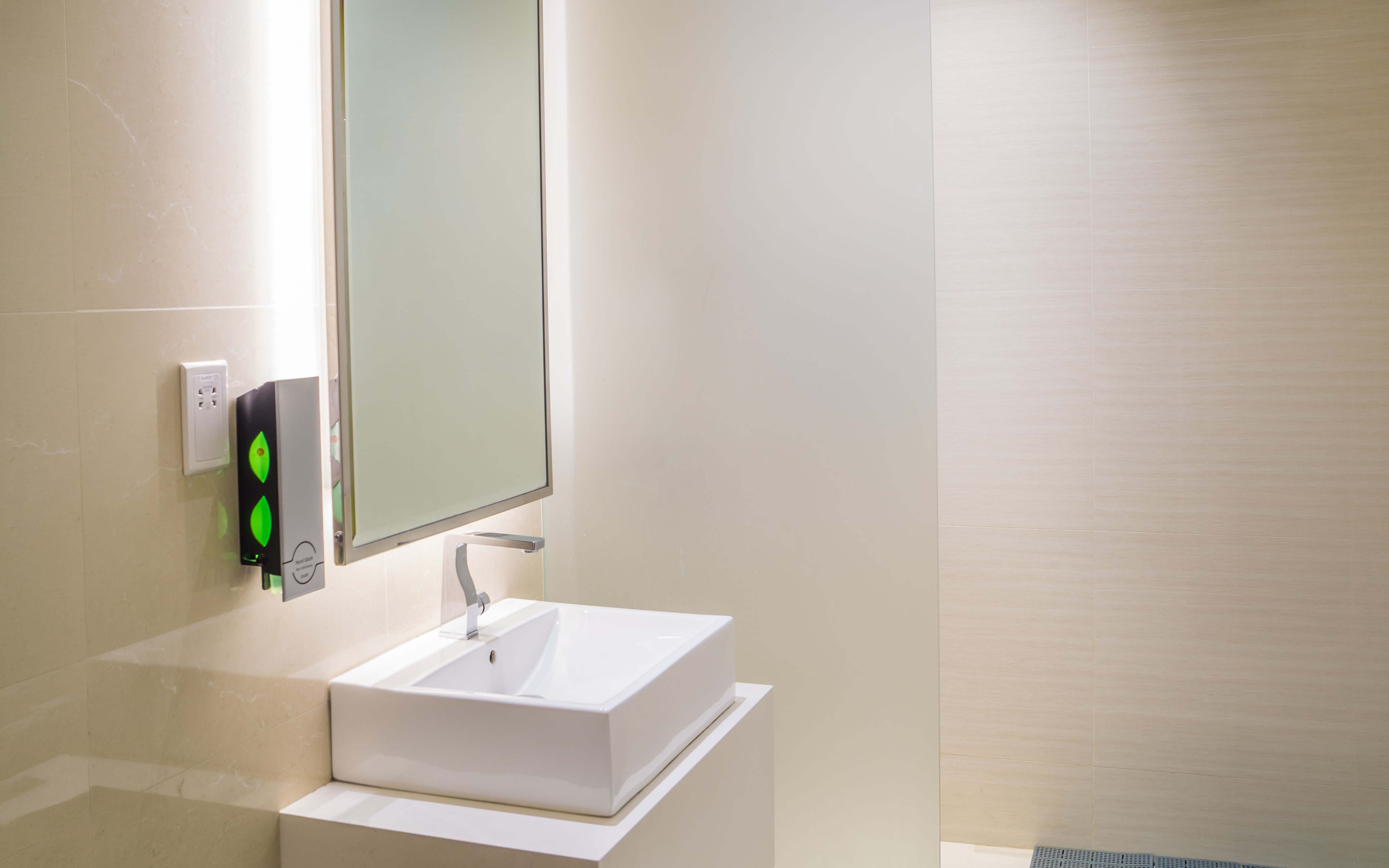 Shower area with sink at Ambassador Transit Lounge, Terminal 3, Changi Airport.