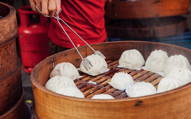 Steamed buns being served on a street food tour in Kuala Lumpur.
