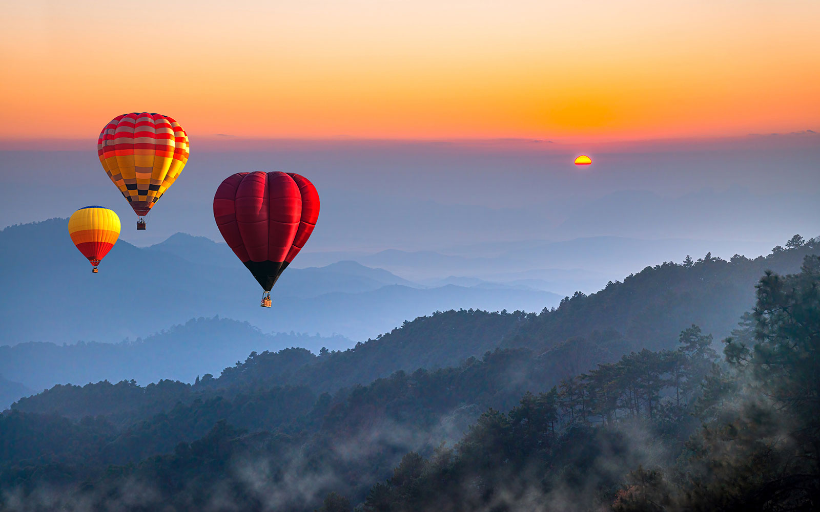 Hot air balloons over Doi Luang Chiang Dao at sunrise, Chiang Mai.