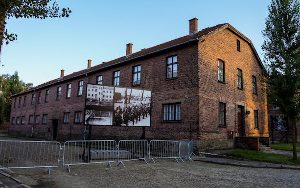 Auschwitz concentration camp entrance gate with "Arbeit Macht Frei" sign, Poland.