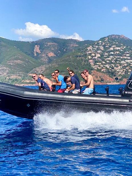 Boat tour group exploring Estérel Natural Park from Cannes.