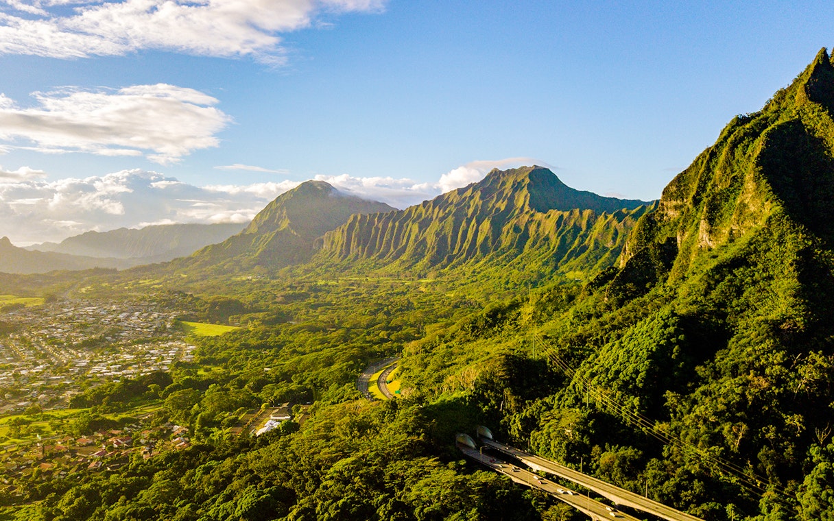 Kualoa Ranch landscape with lush green mountains in Oahu, Hawaii.