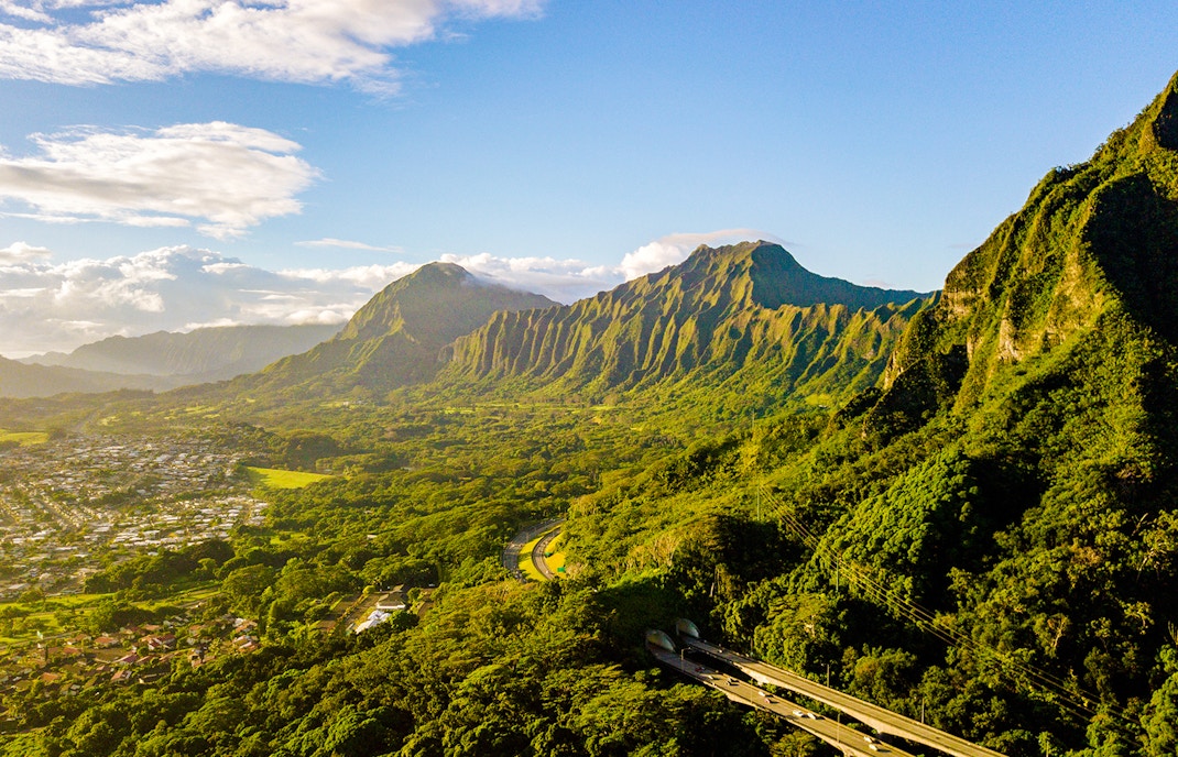 Kualoa Ranch landscape with lush green mountains in Oahu, Hawaii.