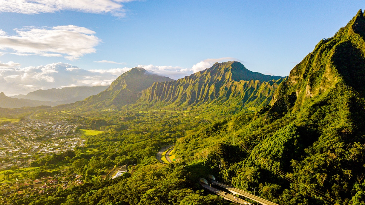 Kualoa Ranch landscape with lush green mountains in Oahu, Hawaii.