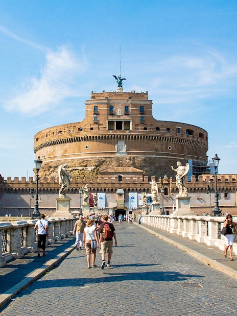 Visitors walking on the bridge towards Castel Sant'Angelo in Rome, Italy.