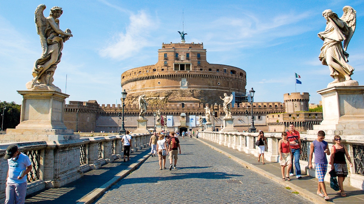 Visitors walking on the bridge towards Castel Sant'Angelo in Rome, Italy.