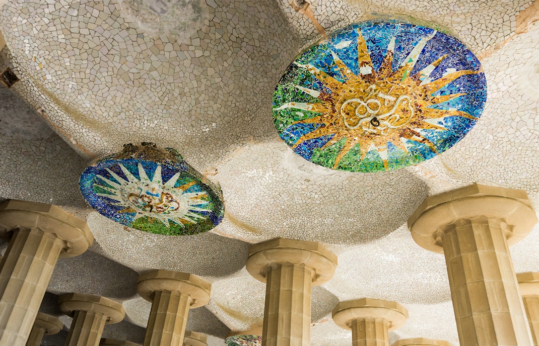 Mosaic ceiling and columns in Park Güell, Barcelona, part of the Combo: Park Güell + Sagrada Familia tour.