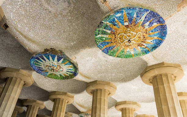 Mosaic ceiling and columns in Park Güell, Barcelona, part of the Combo: Park Güell + Sagrada Familia tour.