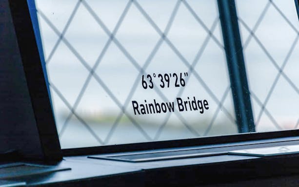 View from Skylon Tower Observation Deck showing Rainbow Bridge coordinates, Niagara Falls, Canada.