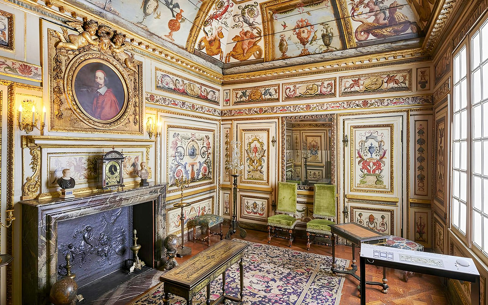 Carnavalet Museum ornate room with historical paintings and antique furniture in Paris.