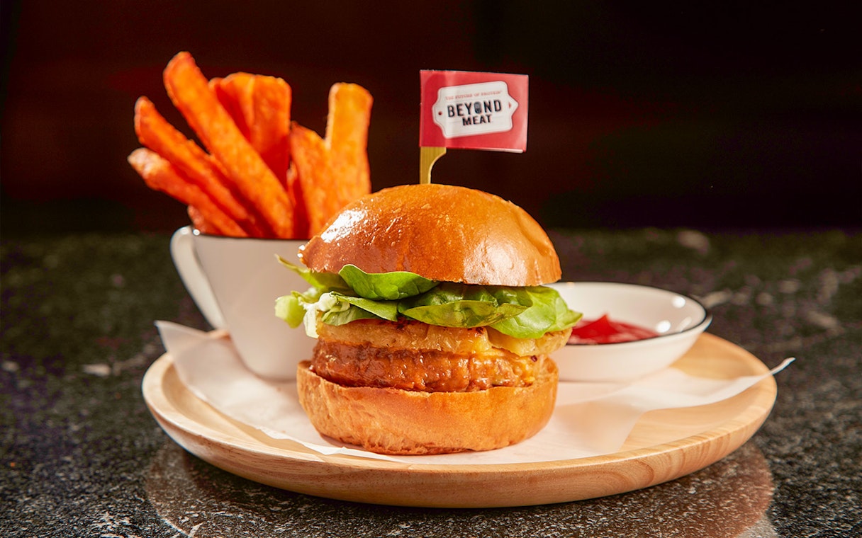 Burger and sweet potato fries served in Hong Kong International Airport's first-class lounge.