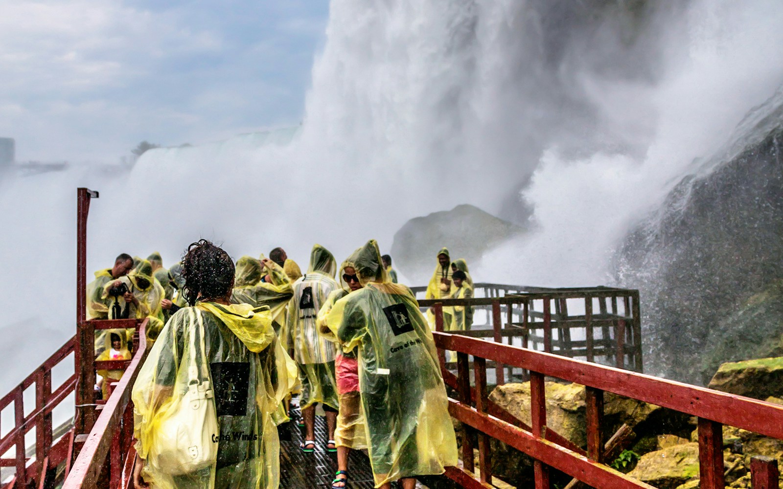 Tourists experiencing Journey Behind the Falls