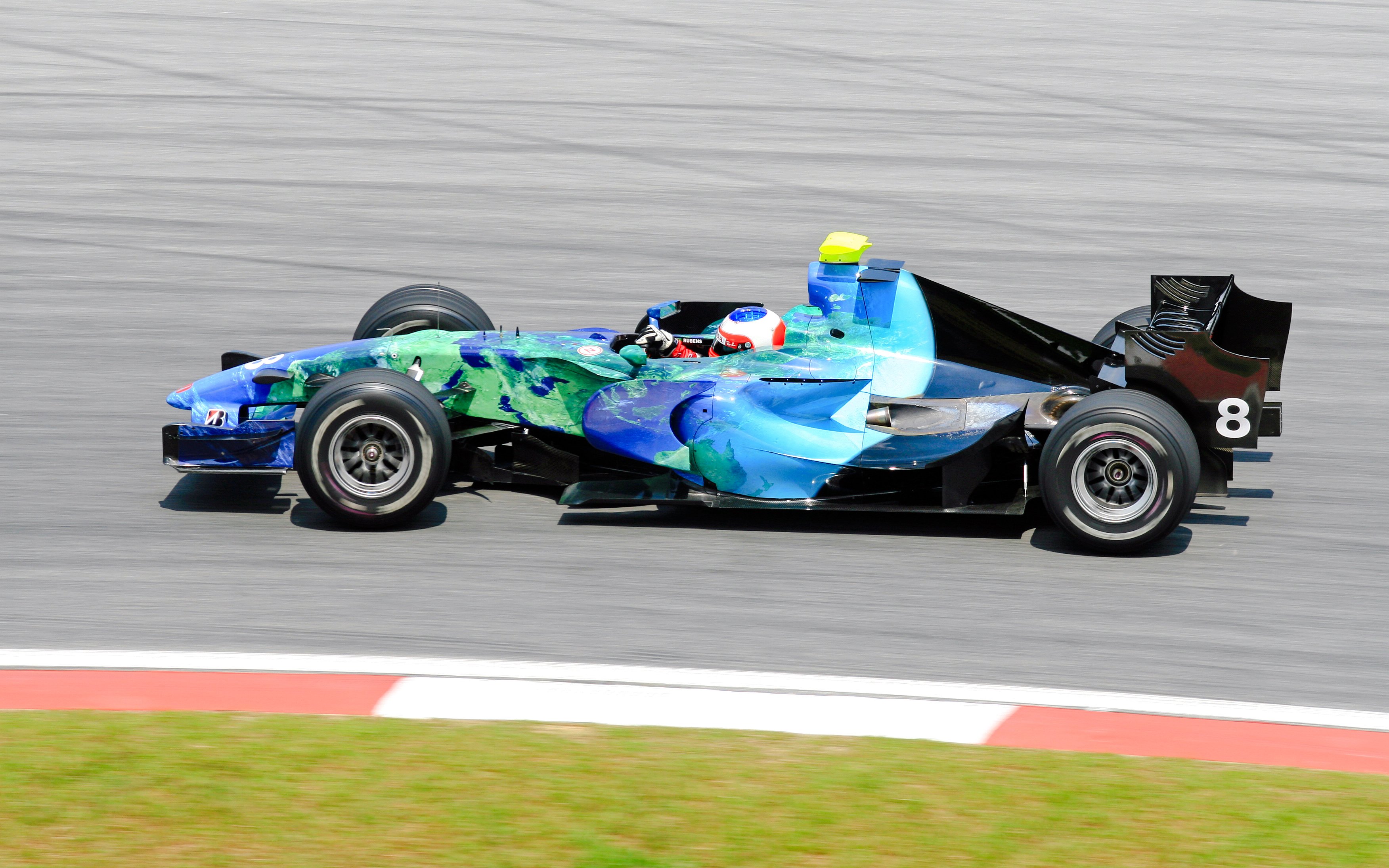 Formula 1 car racing on track during an F1 event.