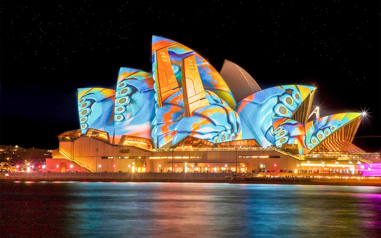 Sydney Opera House illuminated during Vivid Sydney Cruises.