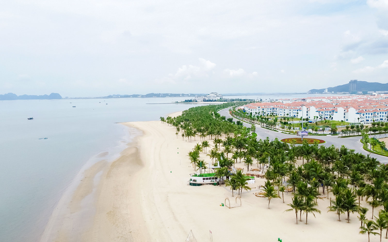 Aerial view of Tuan Chau Island beach and coastline in Ha Long Bay, Vietnam.