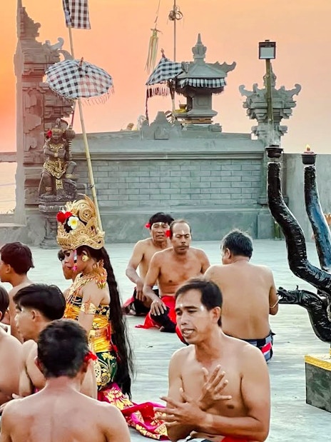 Kecak dance performance at Uluwatu Temple during sunset, Bali.