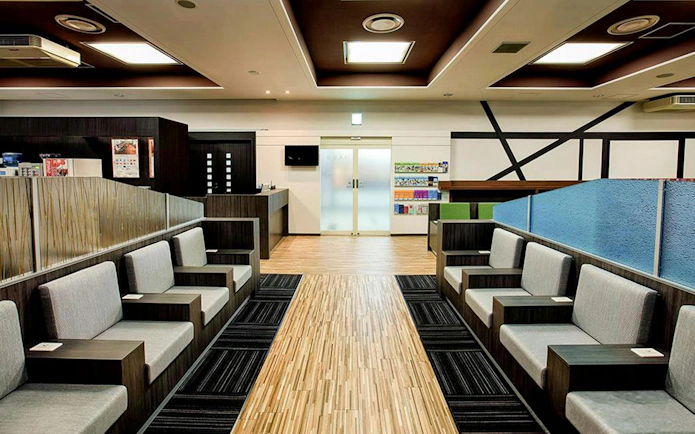Waiting area seating at Narita International Airport Terminal 1 lounge.