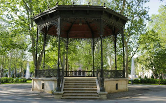 Gazebo in Zrinjevac Park, Zagreb, surrounded by trees and fountains.