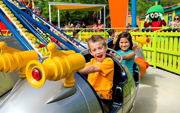 Children enjoying the Marvin the Martian Space Rockets ride at Six Flags Over Texas.