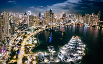 Panama City skyline and Cinta Costera illuminated at night, view of waterfront and skyscrapers.