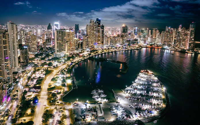 Panama City skyline and Cinta Costera illuminated at night, view of waterfront and skyscrapers.