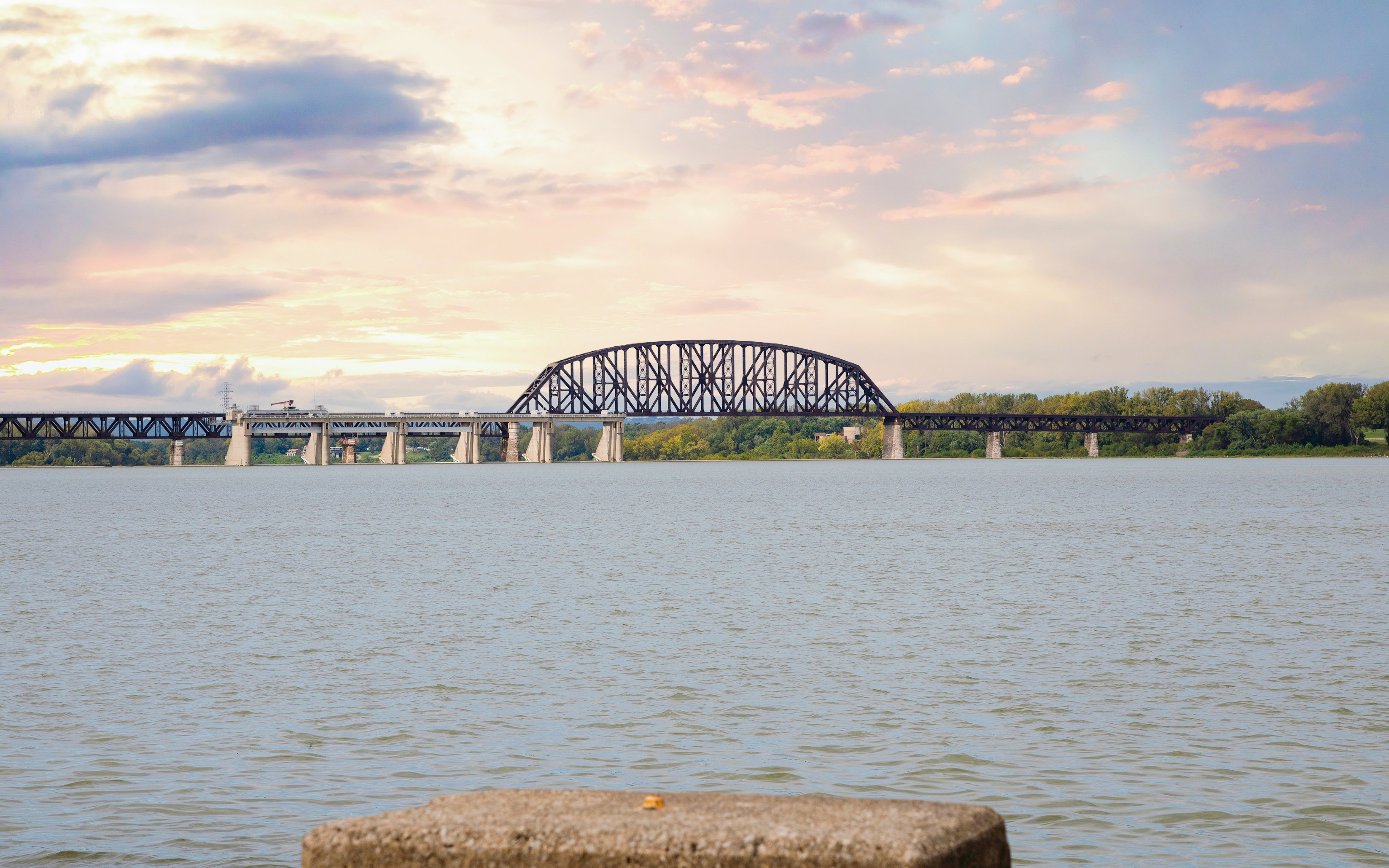 Auckland bridge view from boat cruise at sunset.