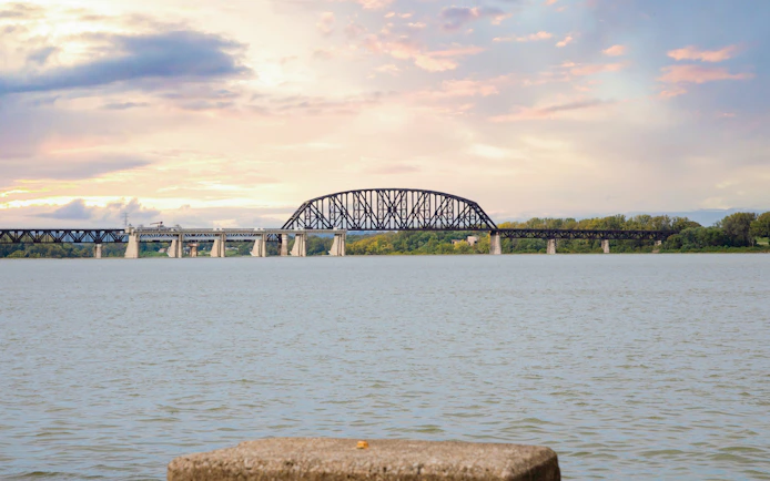 Auckland bridge view from boat cruise at sunset.