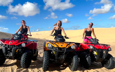 ATV riders on sand dunes during Mui Ne Jeep Tour, Ho Chi Minh City.