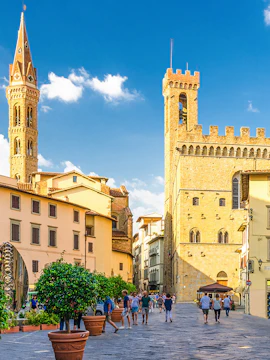 Piazza di San Firenze square with historic buildings and people walking.