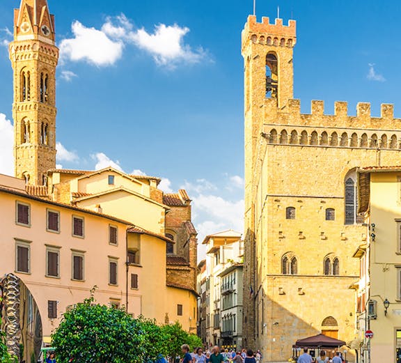 Piazza di San Firenze square with historic buildings and people walking.
