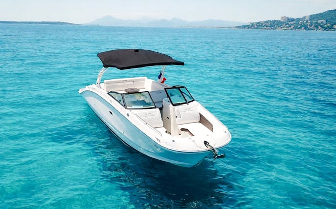 Private boat on clear blue waters near Lérins Islands, Cannes.