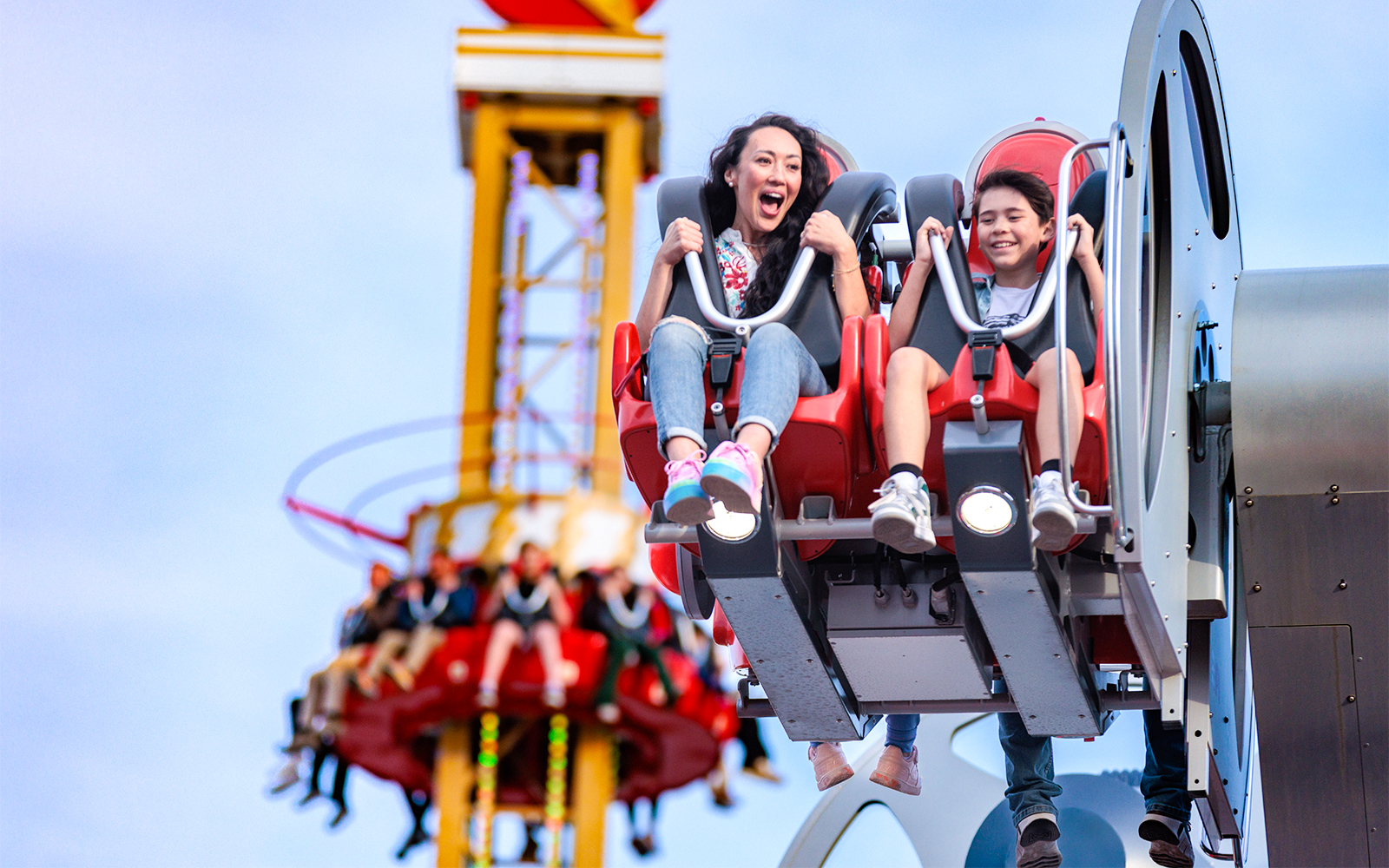 Riders enjoying CYBORG™ Cyber Revolution at Six Flags Fiesta Texas.
