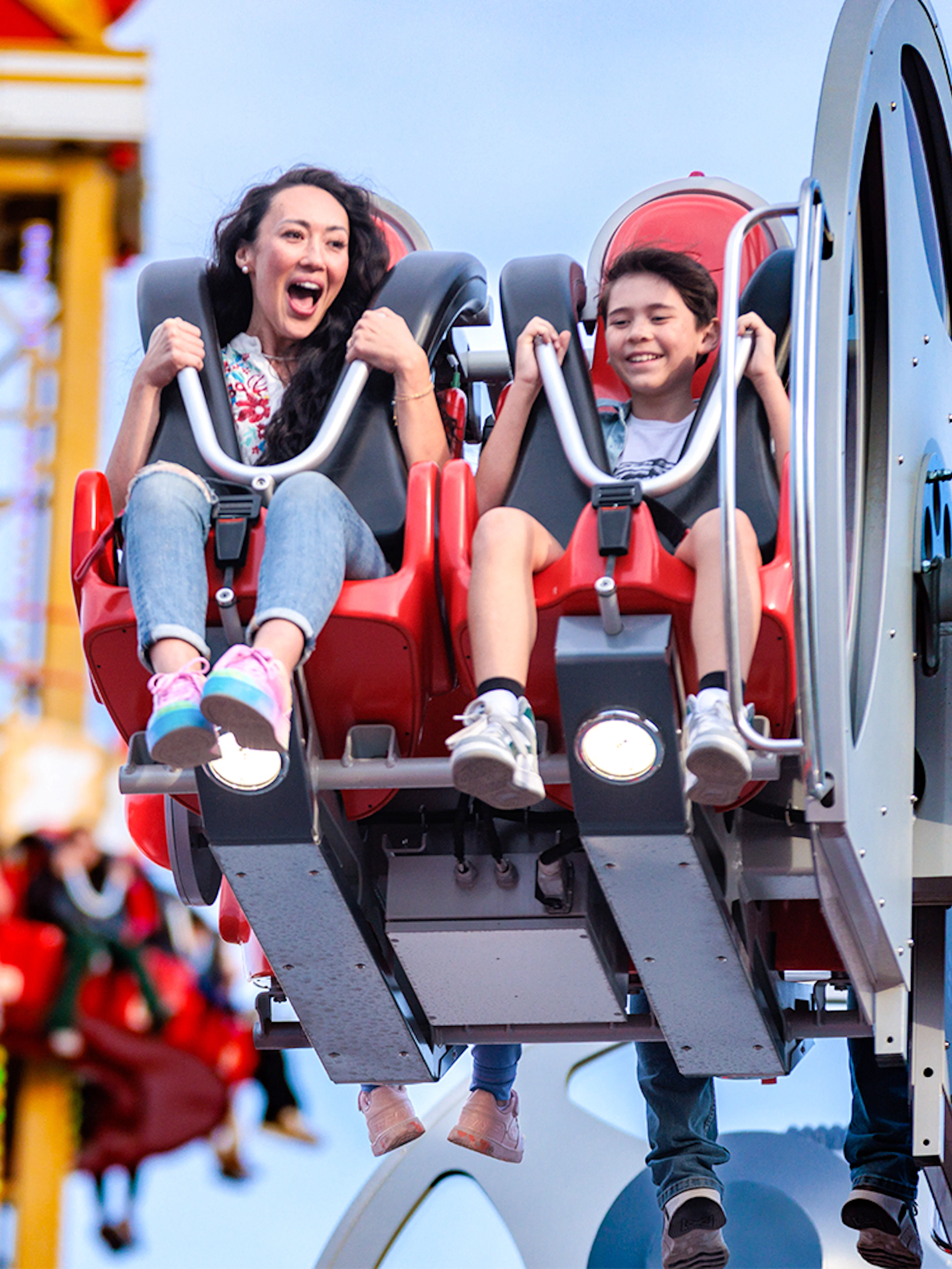 Riders enjoying CYBORG™ Cyber Revolution at Six Flags Fiesta Texas.