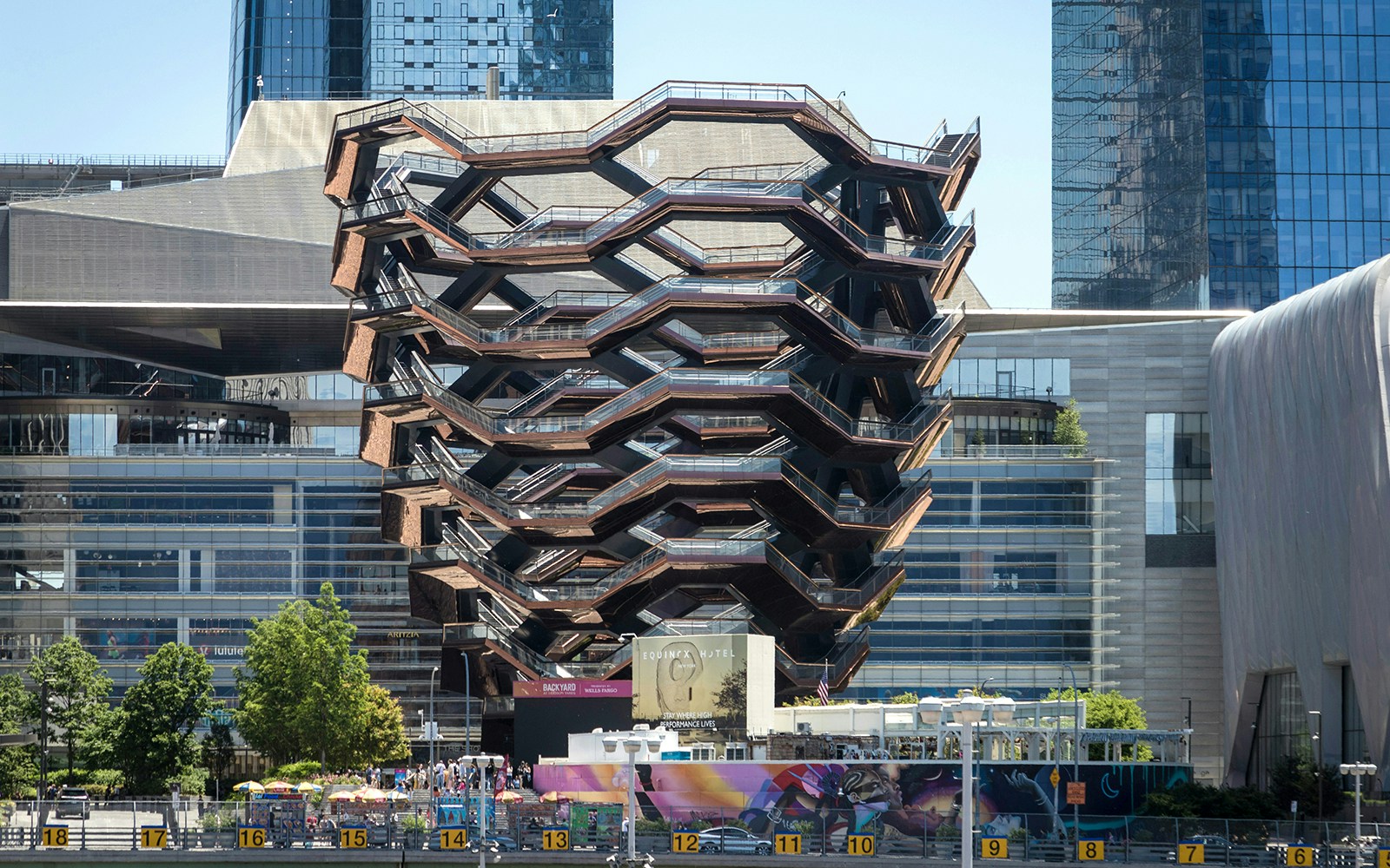 Vessel structure at Hudson Yards, New York City, with surrounding skyscrapers.