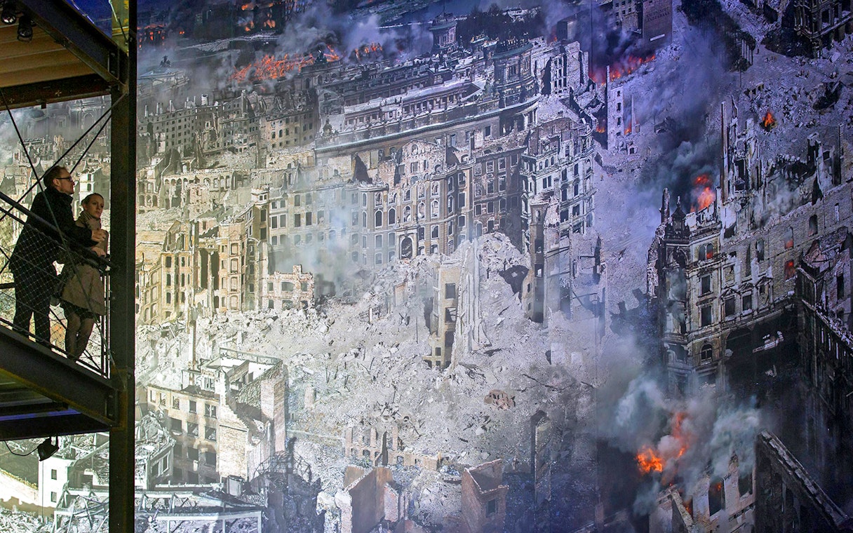 Visitors viewing Dresden ruins panorama at Panometer Dresden.