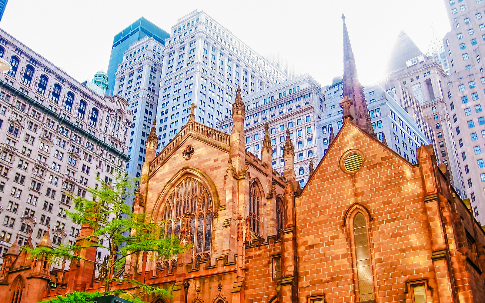 Holy Trinity Church facade with skyscrapers in the background, New York City.