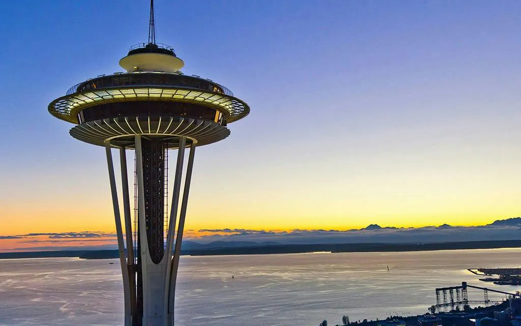 Space Needle at sunset overlooking Seattle waterfront, part of the Harbor of Secrets Golden Mermaid Hunt.