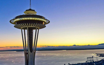 Space Needle at sunset overlooking Seattle waterfront, part of the Harbor of Secrets Golden Mermaid Hunt.