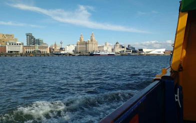 Mersey Ferries view of Liverpool waterfront with iconic buildings in the background.