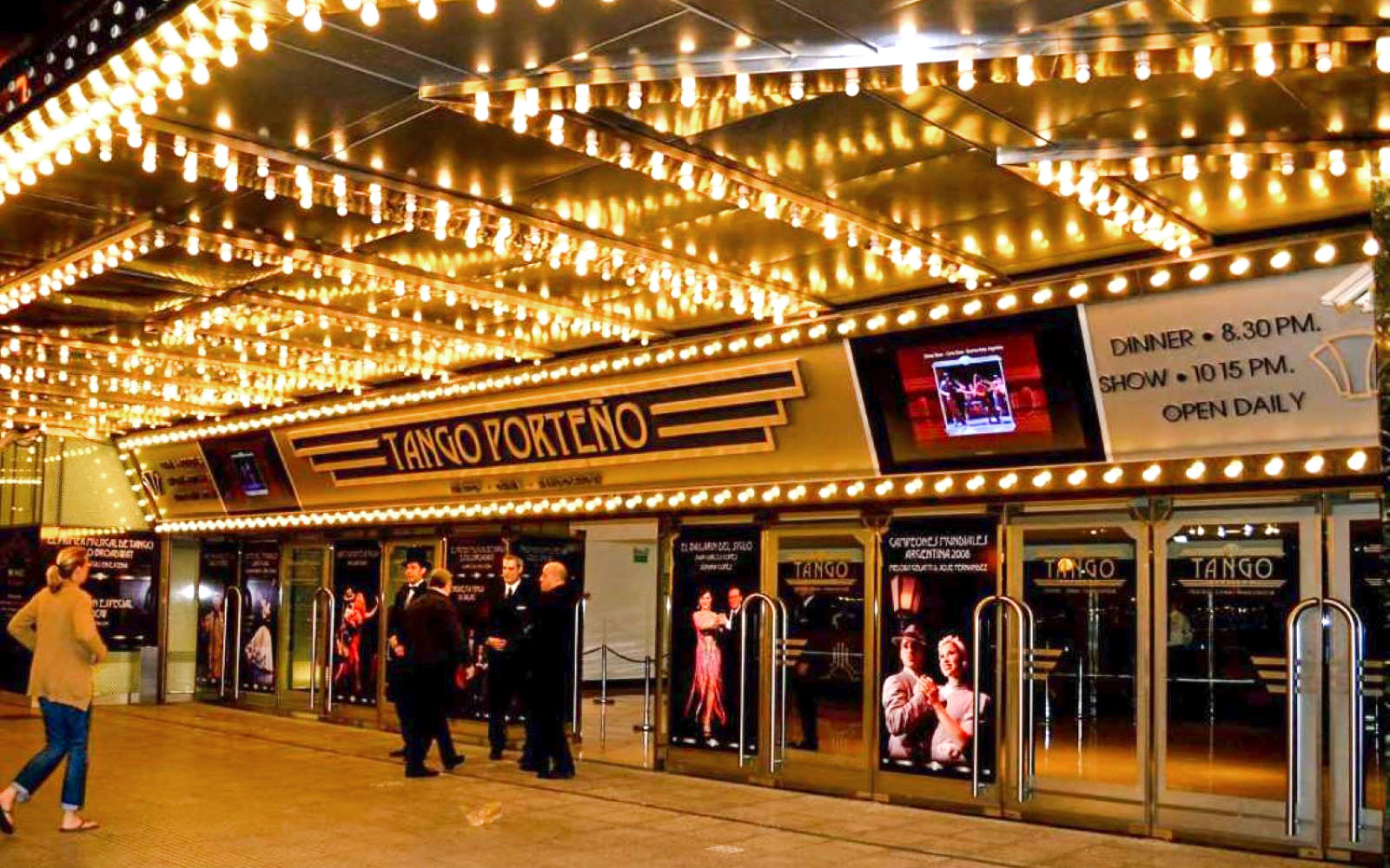 Tango Porteño theater entrance lit with marquee lights in Buenos Aires.
