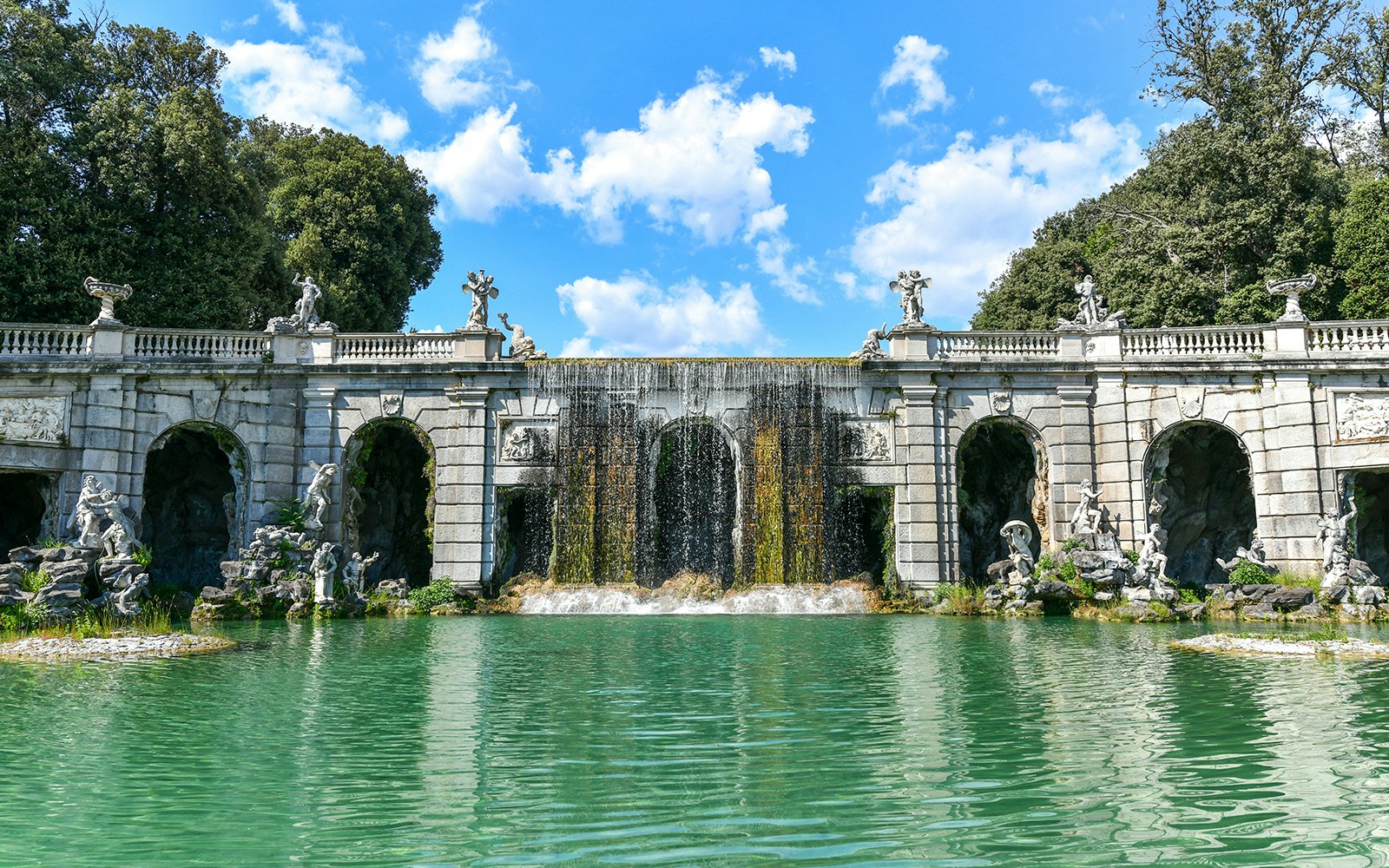 Eolo Fountain at Royal Palace of Caserta with cascading water and ornate sculptures.