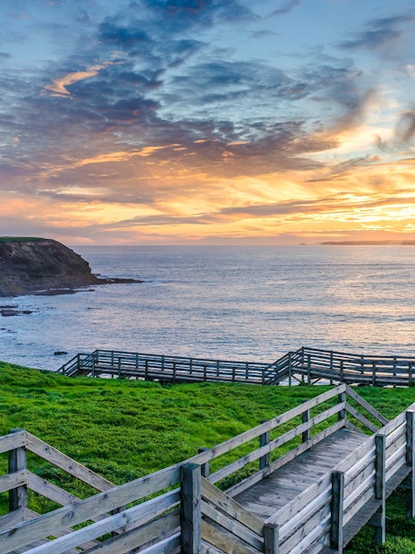 Boardwalk overlooking ocean at sunset on Phillip Island.