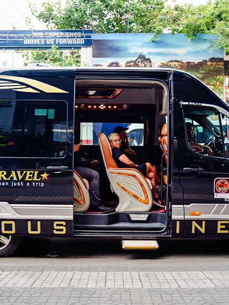 Transfer van for Cu Chi tunnels tour in Ho Chi Minh City.