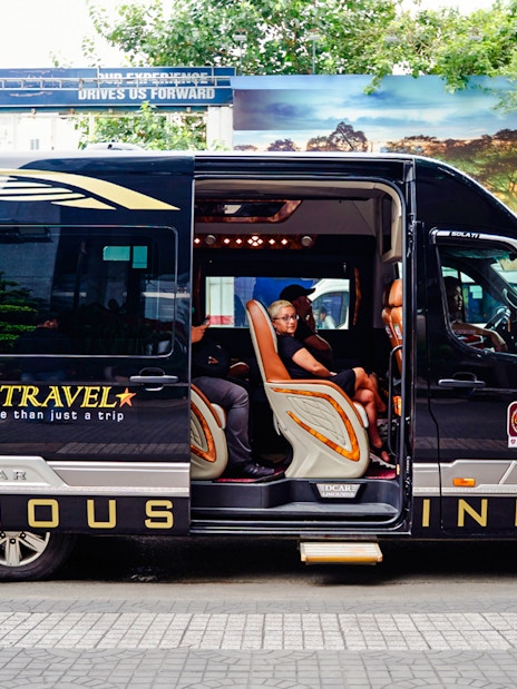 Transfer van for Cu Chi tunnels tour in Ho Chi Minh City.